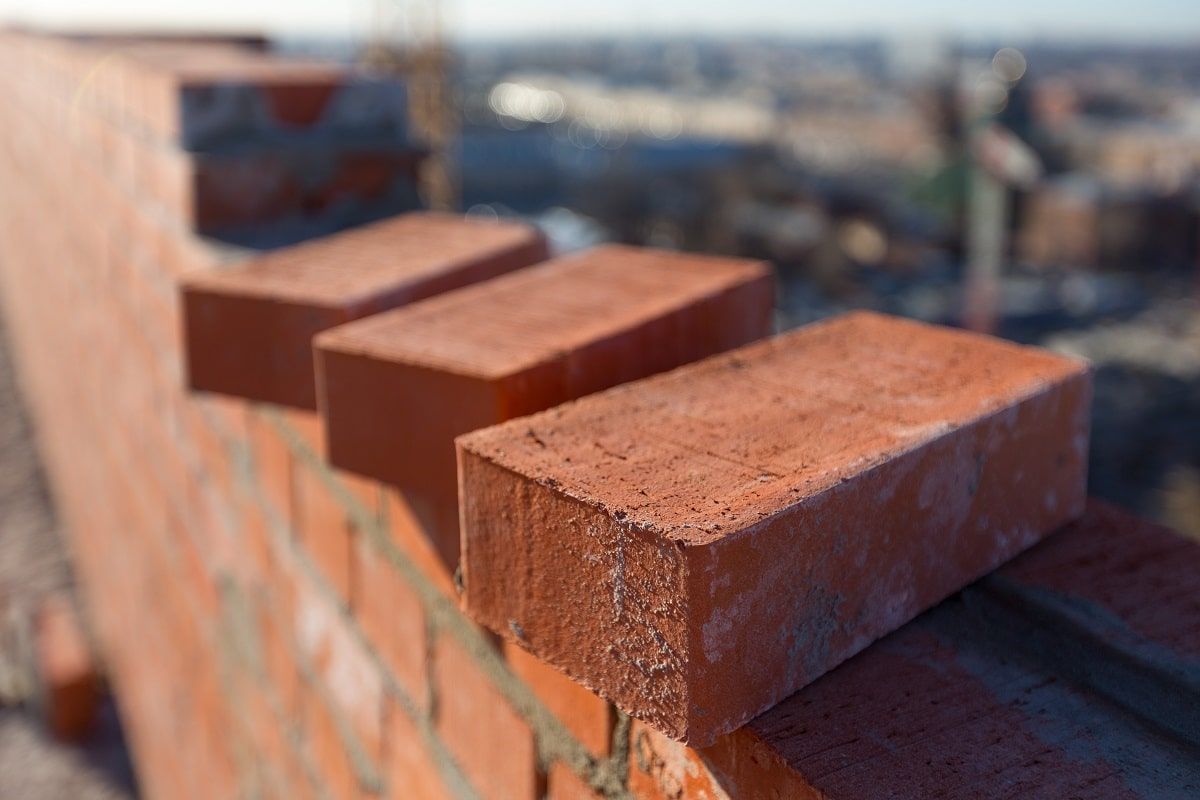 Brick or Wood? How to Choose the Right Material for Your Home